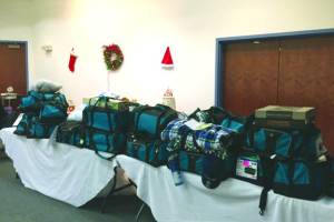 Photo courtesy of Kelly Martin                                 Thirty duffel bags filled by the Kenai Peninsula Association of Realtors for children in the Kenai Peninsula Borough School Districts Students in Transition Program are photographed in December 2018 in Kenai.