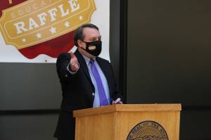 Mike Barnhill, deputy commisioner of the Alaska Department of Revenue, speaks following the drawing of names during the second annual PFD Education Raffle. During the event, state officials and lawmakers wore masks with an education raffle logo. (Ben Hohenstatt / Juneau Empire)