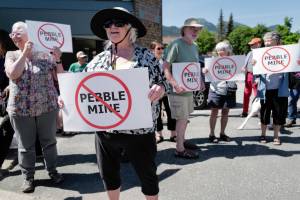 Judy Cavanaugh stands with others at a rally against the Pebble Mine in front of Sen. Lisa Murkowski’s Juneau office in June 2019.  The Army Corps of Engineers has accepted a request for administrative appeal filed by Pebble Limited Partnership. A similar effort by the state was reject, Gov. Mike Dunleavy said in a news release. (Michael Penn / Juneau Empire File)