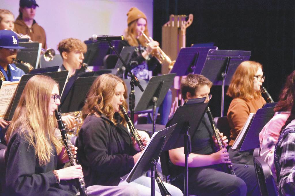 Photos by Jake Dye / Peninsula Clarion 
Members of the Soldotna High School Band rehearse Oct. 11 at Soldotna High School. Below, Audra Calloway directs the choir.