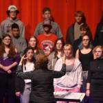 Audra Calloway directs the Soldotna High School Choir in a rehersal on Oct. 11, 2022, at Soldotna High School in Soldotna, Alaska. (Jake Dye/Peninsula Clarion)