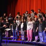 Audra Calloway directs the Soldotna High School Choir in a rehersal on Oct. 11, 2022, at Soldotna High School in Soldotna, Alaska. (Jake Dye/Peninsula Clarion)