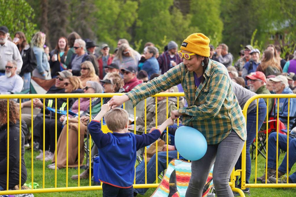 Attendees gather to dance and to listen during a performance by Blackwater Railroad Company, part of the Levitt AMP Soldotna Music Series on Wednesday, June 7, 2023, at Soldotna Creek Park in Soldotna, Alaska. (Jake Dye/Peninsula Clarion)