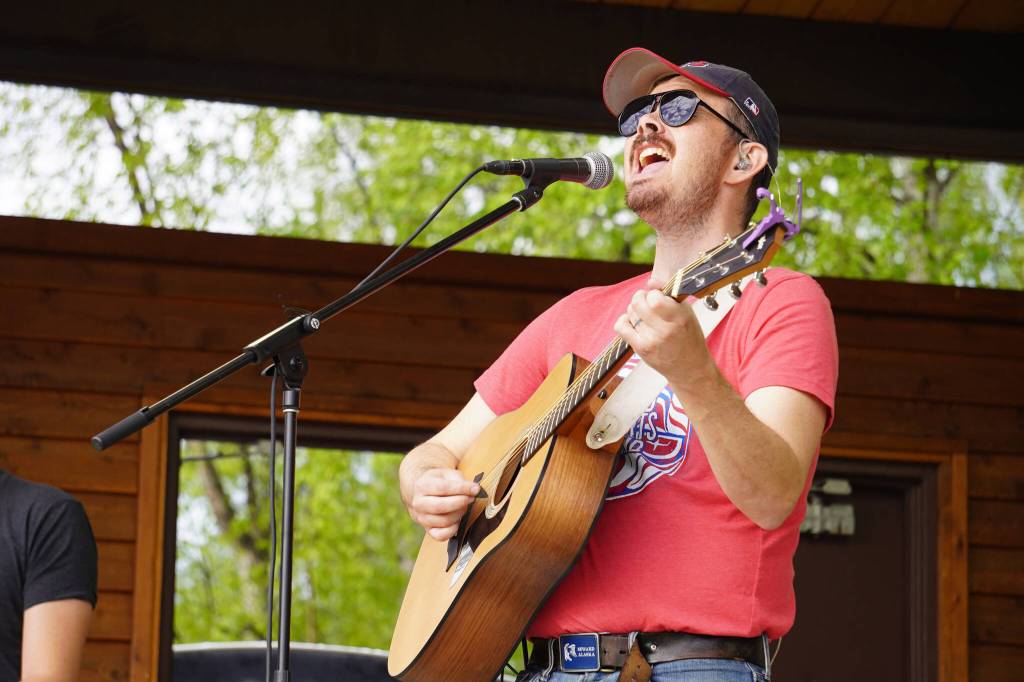 Tyson Davis performs as part of Blackwater Railroad Company during the Levitt AMP Soldotna Music Series on Wednesday, June 7, 2023, at Soldotna Creek Park in Soldotna, Alaska. (Jake Dye/Peninsula Clarion)