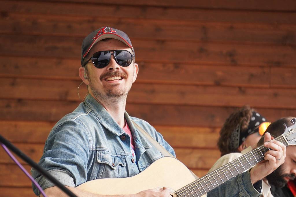 Tyson Davis performs as part of Blackwater Railroad Company during the Levitt AMP Soldotna Music Series on Wednesday, June 7, 2023, at Soldotna Creek Park in Soldotna, Alaska. (Jake Dye/Peninsula Clarion)