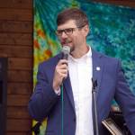 Sen. Jesse Bjorkman awards members of the Kenai Central High School cheerleading team with a legislative citation ahead of the start of the Soldotna Music Series performance on Wednesday, June 21, 2023, at Soldotna Creek Park in Soldotna, Alaska. (Jake Dye/Peninsula Clarion)
