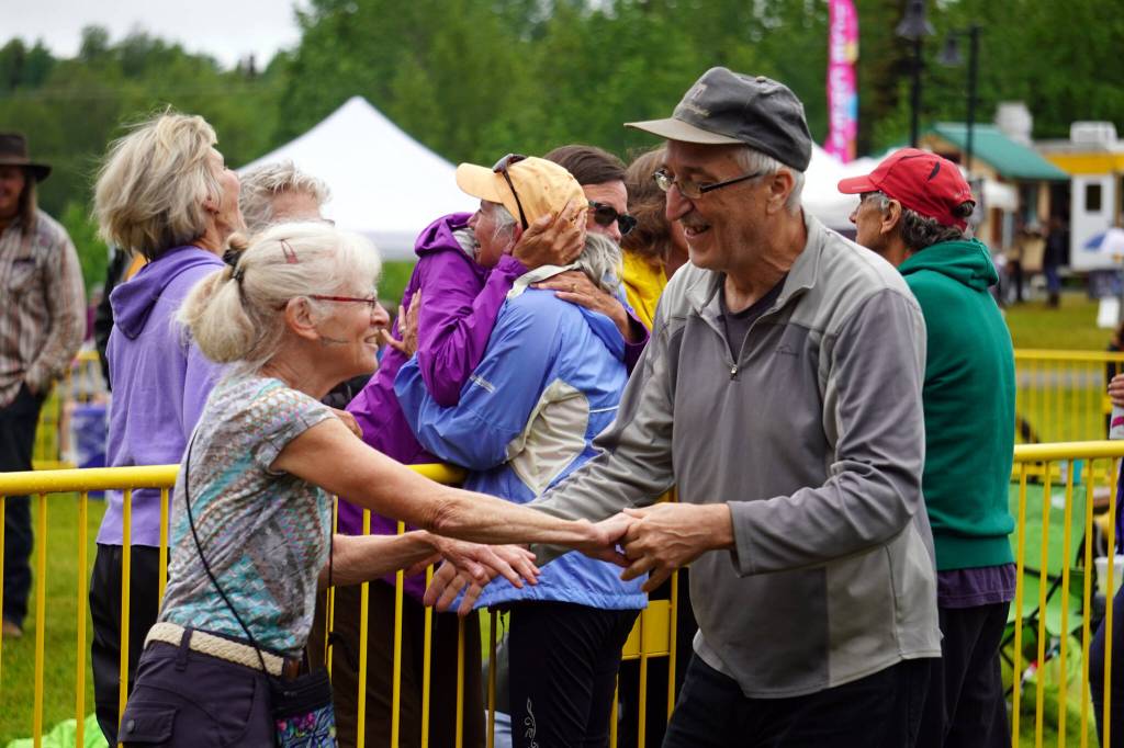 Attendees dance before the stage as Connie Brannocks Tiny House of Funk performs during the Soldotna Music Series at Soldotna Creek Park in Soldotna, Alaska, on Wednesday, June 21, 2023. (Jake Dye/Peninsula Clarion)