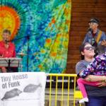 Attendees dance before the stage as Connie Brannocks Tiny House of Funk performs during the Soldotna Music Series at Soldotna Creek Park in Soldotna, Alaska, on Wednesday, June 21, 2023. (Jake Dye/Peninsula Clarion)