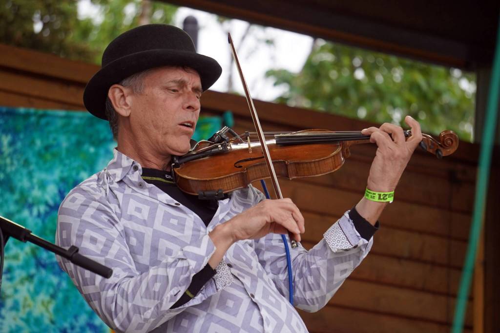 Rob Paulus, part of Connie Brannocks Tiny House of Funk, performs during the Soldotna Music Series at Soldotna Creek Park in Soldotna, Alaska, on Wednesday, June 21, 2023. (Jake Dye/Peninsula Clarion)