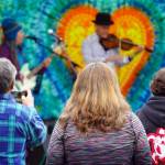 Attendees gather before the stage as Connie Brannocks Tiny House of Funk performs during the Soldotna Music Series at Soldotna Creek Park in Soldotna, Alaska, on Wednesday, June 21, 2023. (Jake Dye/Peninsula Clarion)
