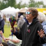 Attendees dance before the stage as Wasabi Black performs during the Soldotna Music Series at Soldotna Creek Park in Soldotna, Alaska, on Wednesday, June 21, 2023. (Jake Dye/Peninsula Clarion)