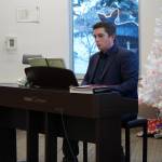 Justin Ruffridge performs during Music by the Fire at the Soldotna Public Library in Soldotna, Alaska, on Thursday, Dec. 21, 2023. (Jake Dye/Peninsula Clarion)