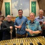 The 2022 lineup of John Dambergs Latin Jazz Quintet stand for a photo in 2022. John Damberg plays marimba and vibes, Mark Manners plays classical guitar, Bob Andrews plays bass guitar and Eiden Pospisil plays drums. Laura Koenig, pictured here with a flute, will not be playing with the quintet this weekend  the group will instead feature Karl Pasch on clarinet. (Photo courtesy John Damberg)