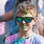 Participants are covered with colored powder during a color run held as part of during the Levitt AMP Soldotna Music Series on Wednesday, June 7, 2023, at the Kenai National Wildlife Refuge Visitors Center in Soldotna, Alaska. (Jake Dye/Peninsula Clarion)