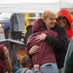 Attendees dance in the rain as Hope Social Club headlines the opening night of the 2024 Levitt AMP Soldotna Music Series at Soldotna Creek Park in Soldotna, Alaska, on Wednesday, June 5, 2024. (Jake Dye/Peninsula Clarion)