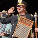 Members of the Salmonfest Marching Band join the Roland Roberts Band onstage at Salmonfest in Ninilchik, Alaska, on Saturday, Aug. 3, 2024. (Jake Dye/Peninsula Clarion)