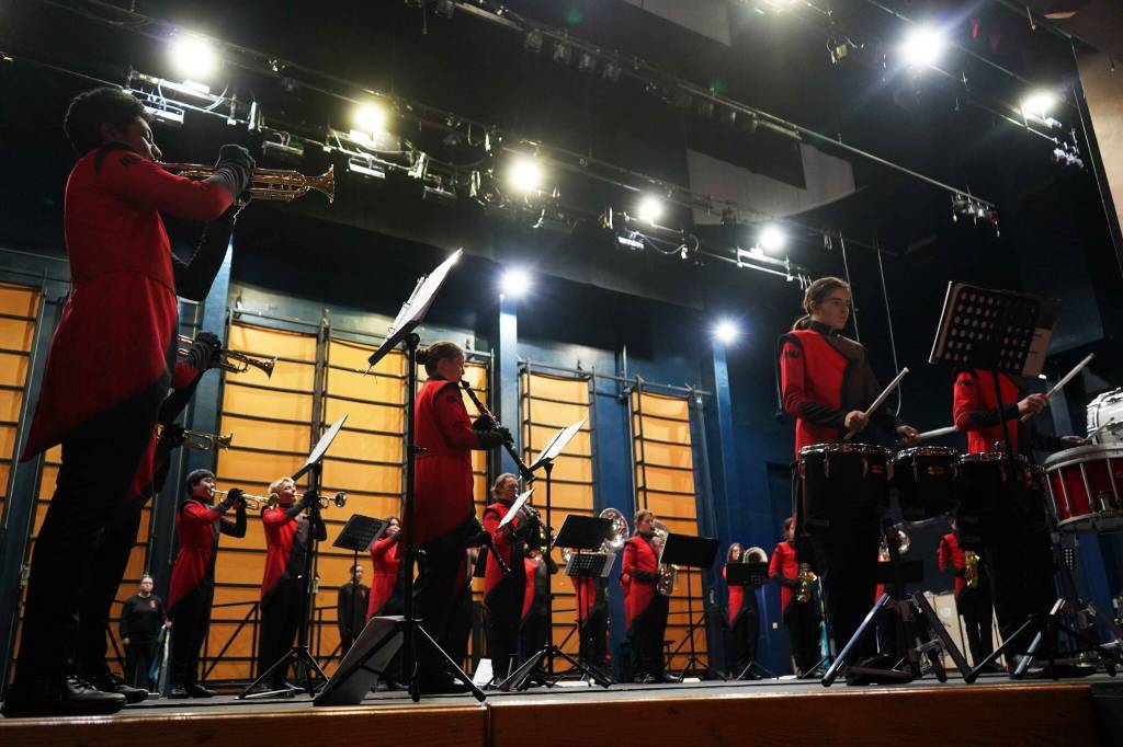 The Kenai Marching Band debuts their new routine based on The Hunger Games: The Ballad of Songbirds & Snakes during an exhibition at Kenai Central High School on Friday, Aug. 16, 2024. (Jake Dye/Peninsula Clarion)