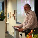 Associate Professor of Accounting Tom Dalrymple speaks before the opening of a memorial art gallery for Kenai Peninsula College Associate Professor of Art Cambid-J Cam Choy at Kenai Peninsula College in Soldotna, Alaska, on Friday, Sept. 13, 2024. (Jake Dye/Peninsula Clarion)