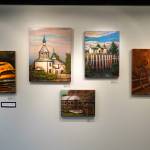 Artwork by Susie Scrivner for her exhibition, Portraits of the Kenai, fills the walls of the Kenai Art Center in Kenai, Alaska, on Thursday, Oct. 3, 2024. (Jake Dye/Peninsula Clarion)