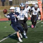 Soldotnas Owen Buckbee pitches the ball in front of Chugiaks Elijah Ortega in the Division II semifinal Saturday, Oct. 19, 2024, at Justin Maile Field at Soldotna High School in Soldotna, Alaska. (Photo by Jeff Helminiak/Peninsula Clarion)