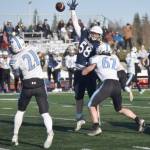 Chugiaks Kaleb Worland has to deal with pressure from Soldotnas Theo Huff in the Division II semifinal Saturday, Oct. 19, 2024, at Justin Maile Field at Soldotna High School in Soldotna, Alaska. (Photo by Jeff Helminiak/Peninsula Clarion)