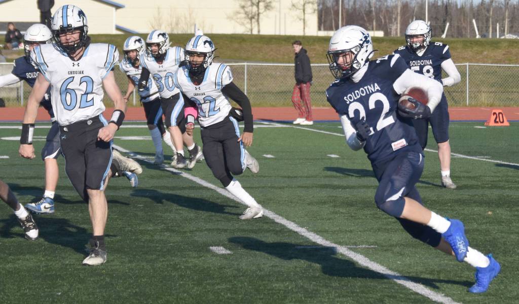 Soldotnas Matthew Schilling rushes the ball against Chugiak in the Division II semifinal Saturday, Oct. 19, 2024, at Justin Maile Field at Soldotna High School in Soldotna, Alaska. (Photo by Jeff Helminiak/Peninsula Clarion)