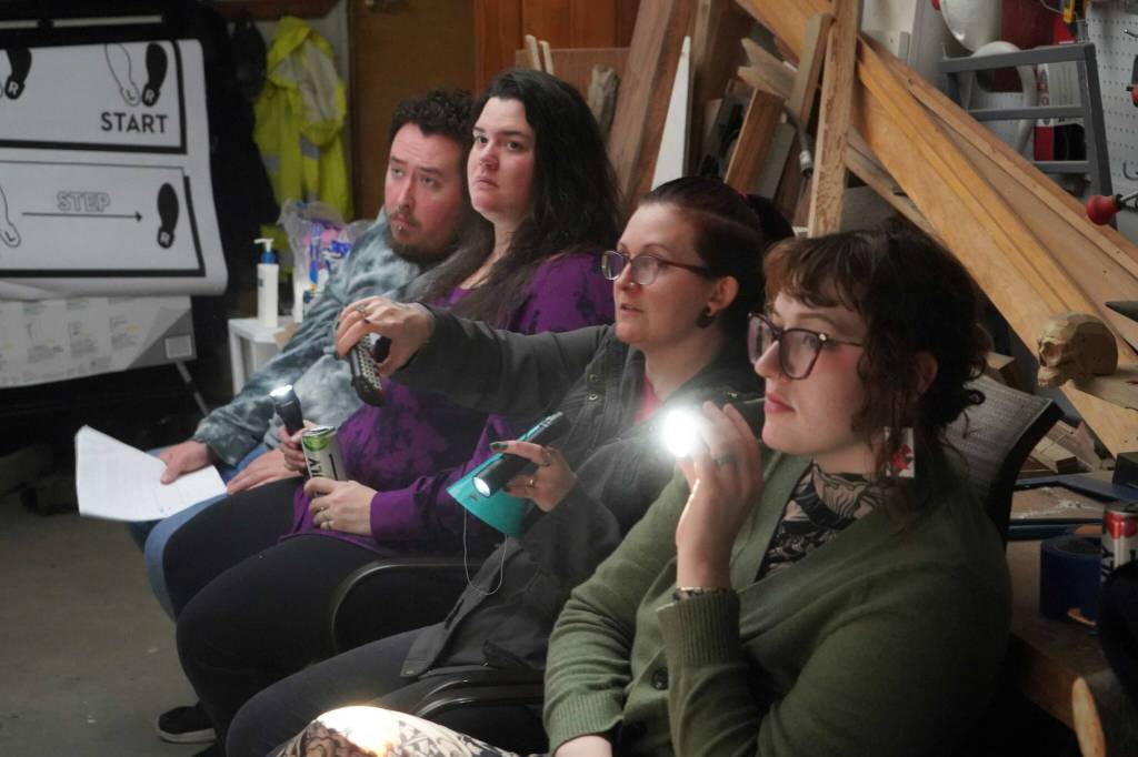 Robyn Chai, center right, directs Intuition Salons shadow cast of Rocky Horror Picture Show during a rehearsal in Kenai, Alaska, on Monday, Oct. 21, 2024. (Jake Dye/Peninsula Clarion)