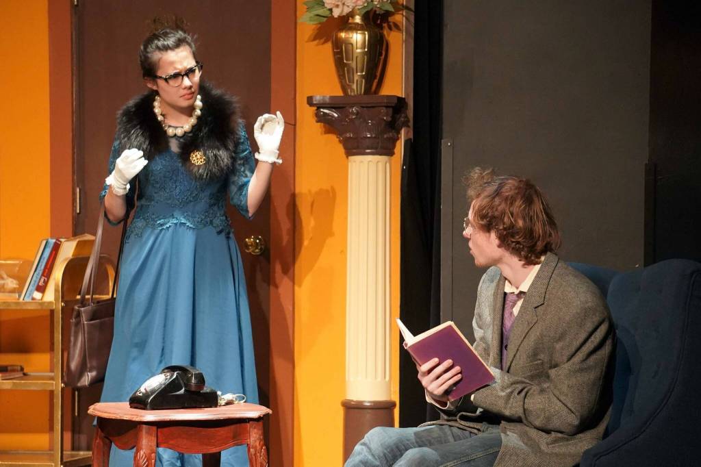 Nia Mulholland-Kim, as Mrs. Peacock, and Kameron Smith, as Professor Plum, rehearse Seward High School Theatre Collectives Clue at Seward High School in Seward, Alaska, on Thursday, Nov. 7, 2024. (Jake Dye/Peninsula Clarion)