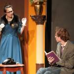 Nia Mulholland-Kim, as Mrs. Peacock, and Kameron Smith, as Professor Plum, rehearse Seward High School Theatre Collectives Clue at Seward High School in Seward, Alaska, on Thursday, Nov. 7, 2024. (Jake Dye/Peninsula Clarion)