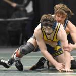 Homers Brayden Woods wrestles to a 7-0 decision over Delen Beck of Valdez in the final at 160 pounds at the Division II state wrestling tournament Saturday, Dec. 21, 2024, at the Alaska Airlines Center in Anchorage, Alaska. (Photo by Jeff Helminiak/Peninsula Clarion)