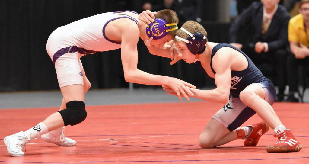 Lathrops Tanner Rhoton wrestles to a 4-3 decision over Soldotnas Sam Henry in the final at 103 pounds at the Division I state wrestling tournament Saturday, Dec. 21, 2024, at the Alaska Airlines Center in Anchorage, Alaska. (Photo by Jeff Helminiak/Peninsula Clarion)
