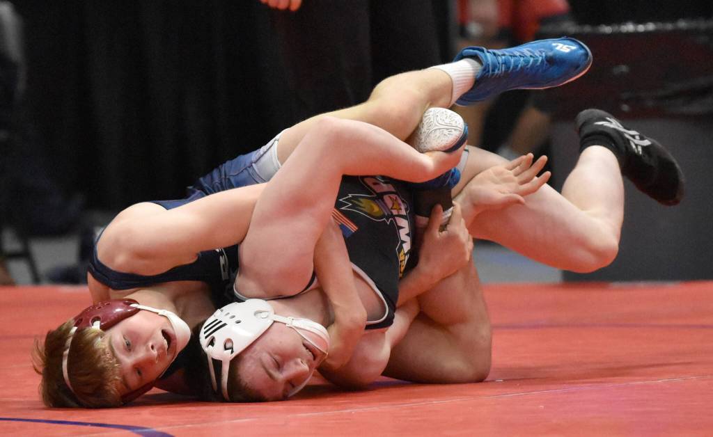 Soldotnas Jacob Strausbaugh wrestles to a technical fall against Student Wrestling Development Programs Brian Grabner in the final at 135 pounds at the Division I state wrestling tournament Saturday, Dec. 21, 2024, at the Alaska Airlines Center in Anchorage, Alaska. (Photo by Jeff Helminiak/Peninsula Clarion)
