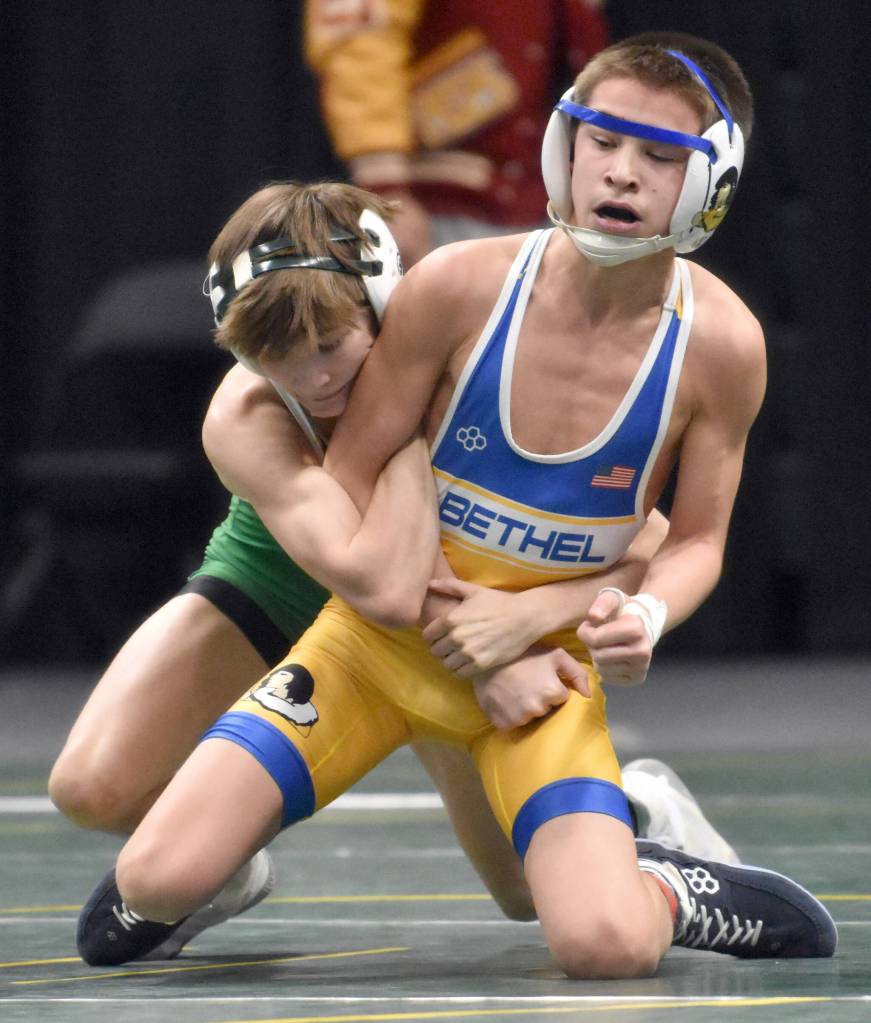Sewards Tommy Jarnig wrestles to a 13-7 decision over Bethels Cole Iverson in the final at 103 pounds at the Division II state wrestling tournament Saturday, Dec. 21, 2024, at the Alaska Airlines Center in Anchorage, Alaska. (Photo by Jeff Helminiak/Peninsula Clarion)
