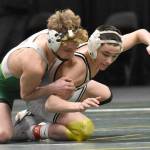 Sewards Hunter Forshee-Kurtz wrestles to an 8-5 decision over Nikiskis Jaxson Young in the final at 135 pounds at the Division II state wrestling tournament Saturday, Dec. 21, 2024, at the Alaska Airlines Center in Anchorage, Alaska. (Photo by Jeff Helminiak/Peninsula Clarion)
