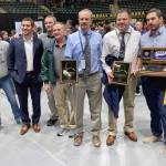 The Soldotna coaching staff of college athlete Trinity Donovan, assistant Sage Castillo, wrestling father Mark Hannevold, volunteer Neldon Gardner, head coach Pete Dickinson, assistant coach Max LeClair and assistant coach Phil Leck at the state wrestling tournament Saturday, Dec. 21, 2024, at the Alaska Airlines Center in Anchorage, Alaska. Dickinson and LeClair were named girls coaches of the year. (Photo by Jeff Helminiak/Peninsula Clarion)