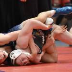 Soldotna's Jacob Strausbaugh wrestles to a technical fall against Student Wrestling Development Program's Brian Grabner in the final at 135 pounds at the Division I state wrestling tournament Saturday, Dec. 21, 2024, at the Alaska Airlines Center in Anchorage, Alaska. (Photo by Jeff Helminiak/Peninsula Clarion)