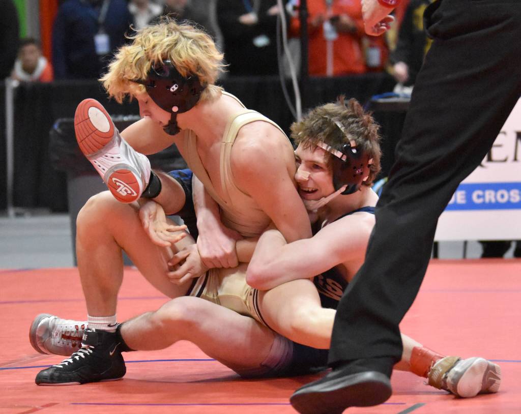 Ketchikans Titan Linne wrestles to a pin against Soldotnas Titus Watts in the final at 125 pounds at the Division I state wrestling tournament Saturday, Dec. 21, 2024, at the Alaska Airlines Center in Anchorage, Alaska. (Photo by Jeff Helminiak/Peninsula Clarion)