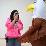 Mountain View Elementary School Principal Hannah Dolphin celebrates as Assistant Principal Aubrie Ellis, in the eagle, is named National Outstanding Assistant Principal of 2025 by the Alaska Association of Elementary School Principals at Mountain View Elementary School in Kenai, Alaska, on Friday, Jan. 10, 2025. (Jake Dye/Peninsula Clarion)