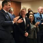 Olympic athlete Alev Kelter, center, smiles as shes recognized during Gov. Mike Dunleavys State of the State speech on Tuesday, Jan. 28, 2025, at the Alaska State Capitol. Next to Kelter is Dunleavys wife, Rose Dunleavy, and Alaska State Trooper Sgt. Jared Noll, who were also recognized during the speech. (Klas Stolpe/Juneau Empire)