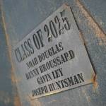 A plaque installed inside a massive firepit built by Class of 2025 Nikiski students includes their names and is seen at Nikiski Middle/High School in Nikiski, Alaska, on Tuesday, Feb. 11, 2025. (Jake Dye/Peninsula Clarion)