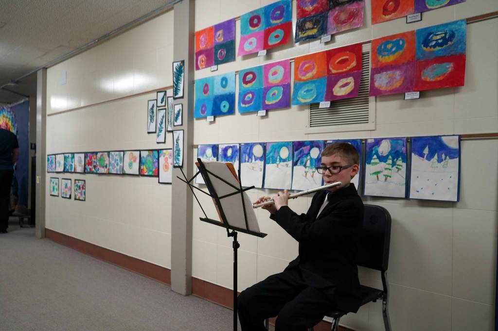 Soldotna Elementary School students perform in the halls during an art show and music fundraiser at Soldotna Elementary School in Soldotna, Alaska, on Thursday, Feb. 27, 2025. (Jake Dye/Peninsula Clarion)