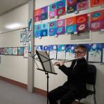 Soldotna Elementary School students perform in the halls during an art show and music fundraiser at Soldotna Elementary School in Soldotna, Alaska, on Thursday, Feb. 27, 2025. (Jake Dye/Peninsula Clarion)
