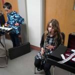 Soldotna Elementary School students perform in the halls during an art show and music fundraiser at Soldotna Elementary School in Soldotna, Alaska, on Thursday, Feb. 27, 2025. (Jake Dye/Peninsula Clarion)