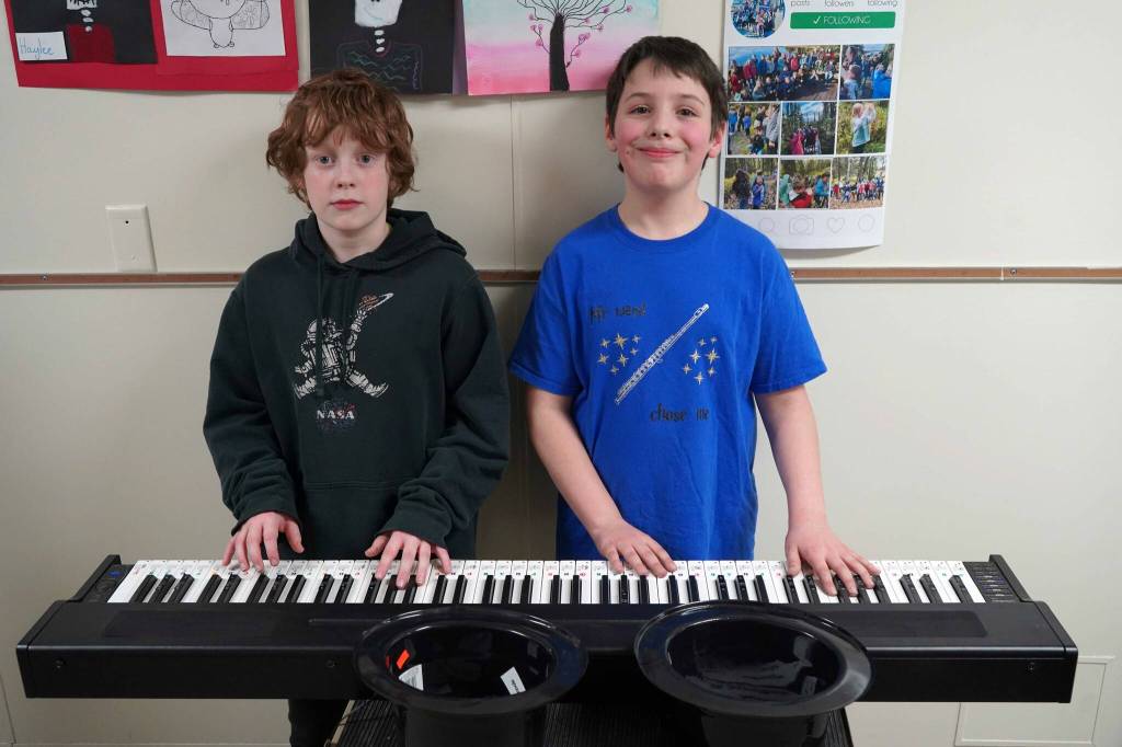 Soldotna Elementary School students perform in the halls during an art show and music fundraiser at Soldotna Elementary School in Soldotna, Alaska, on Thursday, Feb. 27, 2025. (Jake Dye/Peninsula Clarion)