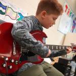 Soldotna Elementary School students perform in the halls during an art show and music fundraiser at Soldotna Elementary School in Soldotna, Alaska, on Thursday, Feb. 27, 2025. (Jake Dye/Peninsula Clarion)
