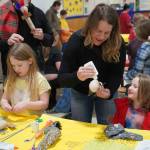Students and families create puppets during a family art night hosted by Artist in Residence Shala Dobson at Kaleidoscope School of Arts and Science in Kenai, Alaska, on Thursday, Feb. 27, 2025. (Jake Dye/Peninsula Clarion)