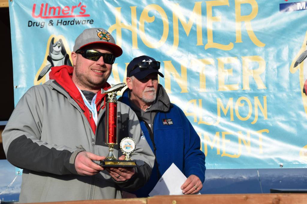 Dustin Klepacki poses with his second-place trophy during the 2025 Homer Winter King Salmon Tournament on Saturday, March 22, 2025, at the Deep Water Dock on the Homer Spit in Homer, Alaska. (Delcenia Cosman/Homer News)