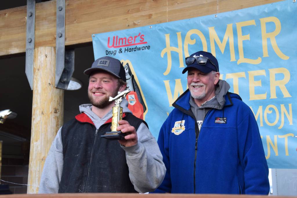 Jack Heinbold, who also won the white king prize, poses with his seventh place trophy during the 2025 Homer Winter King Salmon Tournament on Saturday, March 22, 2025, at the Deep Water Dock on the Homer Spit in Homer, Alaska. (Delcenia Cosman/Homer News)