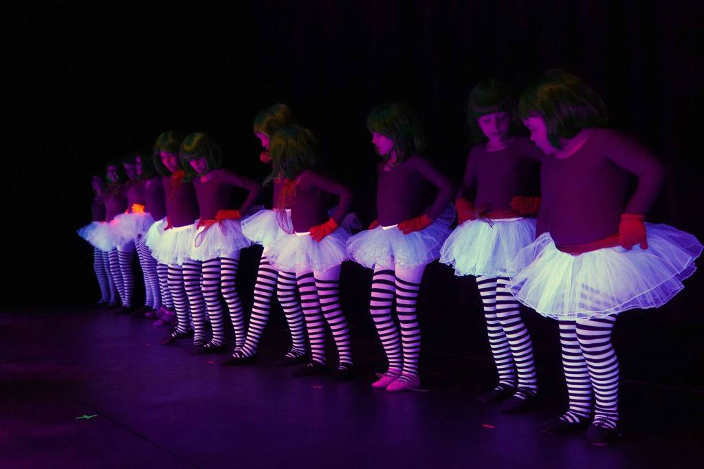 The cast of Seward High School Theatre Collectives Charlie and the Chocolate Factory rehearse on Thursday, April 3, 2025. (Jake Dye/Peninsula Clarion)