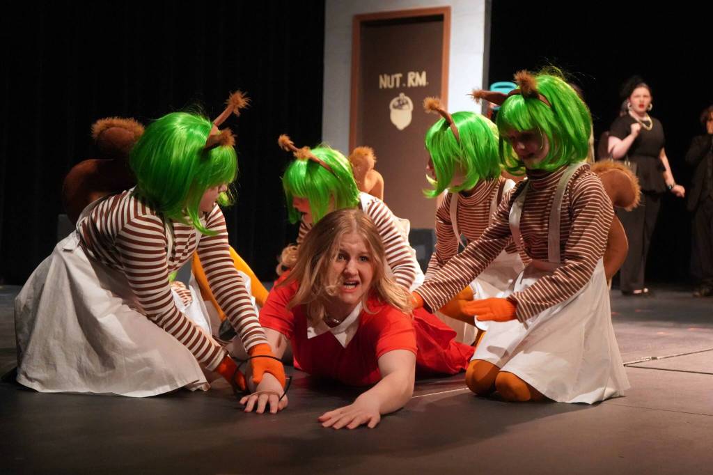 The cast of Seward High School Theatre Collectives Charlie and the Chocolate Factory rehearse on Thursday, April 3, 2025. (Jake Dye/Peninsula Clarion)